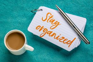 Stay organized - reminder on a stack of index cards with a cup of coffee