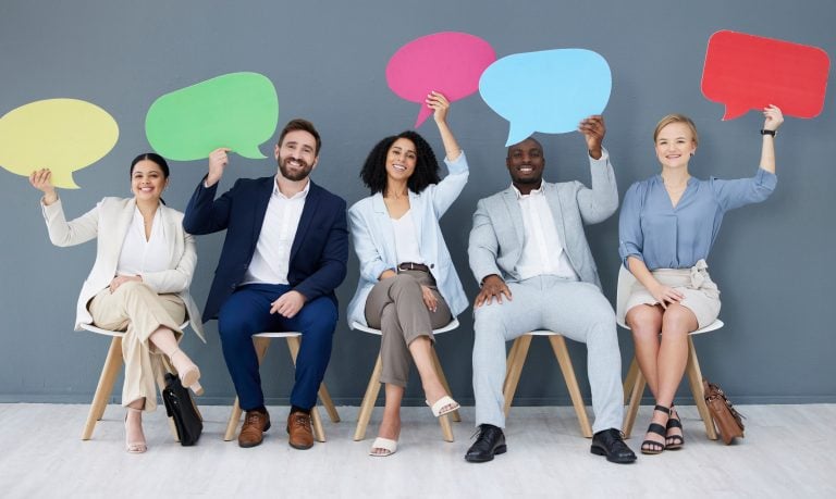 Making the Most of Social Media for Recruiting 1 employees with speech bubbles representing using social media for recruiting